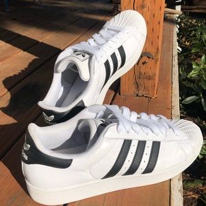 Adidas Superstars (white on black).